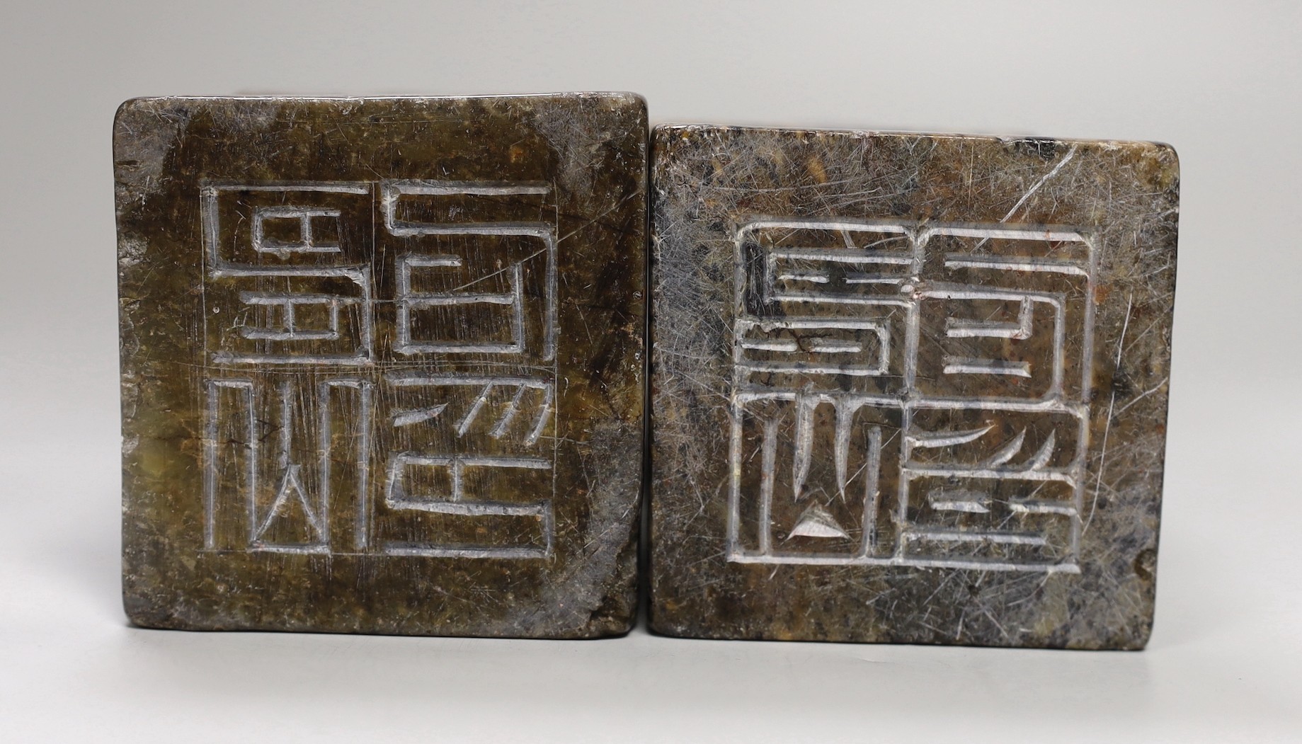 A pair of large Chinese soapstone 'buffalo' seals, 21cm